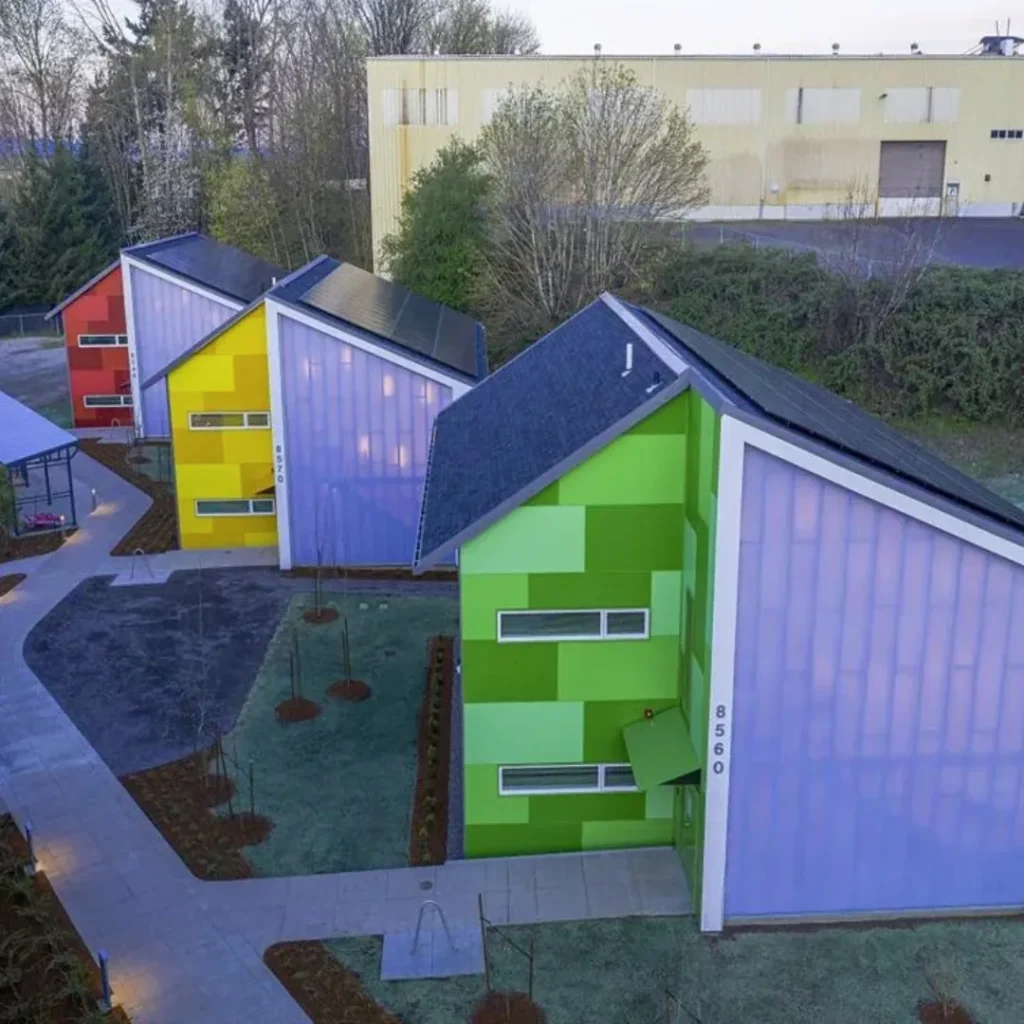 Colorful green, yellow, and red single-room-occupancy cottages at Argyle Gardens in Portland, Oregon